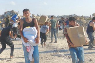 Palestinians storm aid centres despite concerns over checks