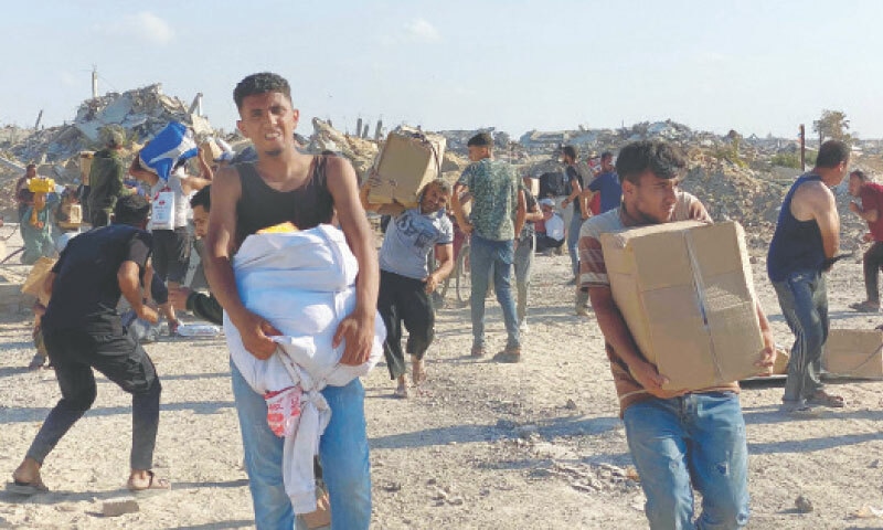 Palestinians storm aid centres despite concerns over checks